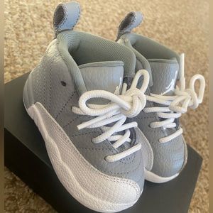 Jordan 12 Retro (td) toddler sneaker size 5C. Color white and gray. Lightly worn